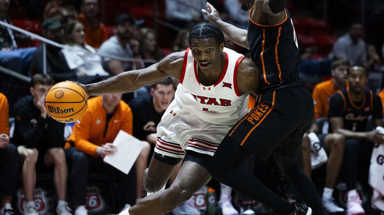Utah Utes forward Ezra Ausar (2) dribbles the ball down the court during a game against the Oklahoma State Cowboys at the Jon M. Huntsman Center on the campus of the University of Utah in Salt Lake City on Saturday, Jan. 11, 2025.