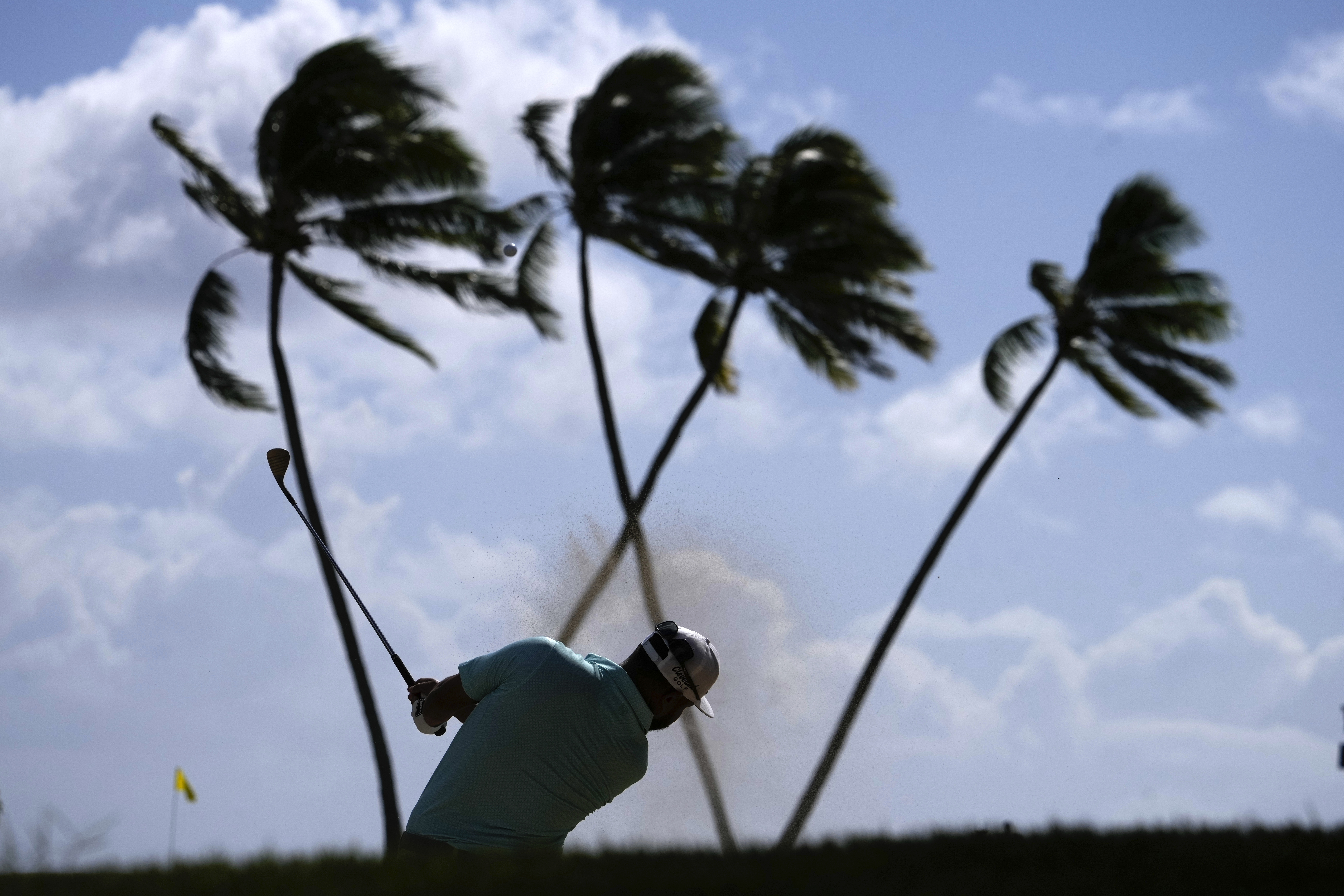 J.J. Spaun chips onto the 16th green during the third round of the Sony Open golf tournament, Saturday, Jan. 11, 2025, at Waialae Country Club in Honolulu.