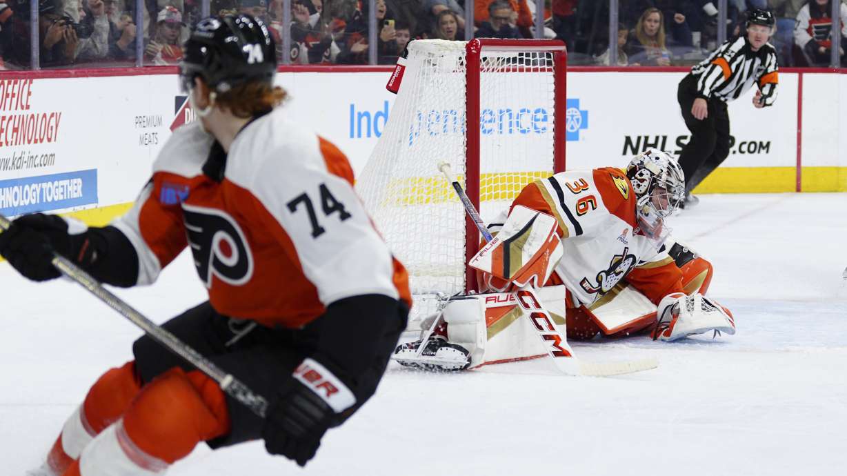 Anaheim Ducks goaltender John Gibson, right, is unable to make a save on a goal scored by Philadelphia Flyers' Owen Tippett (74) during the second period of an NHL hockey game, Saturday, Jan. 11, 2025, in Philadelphia.