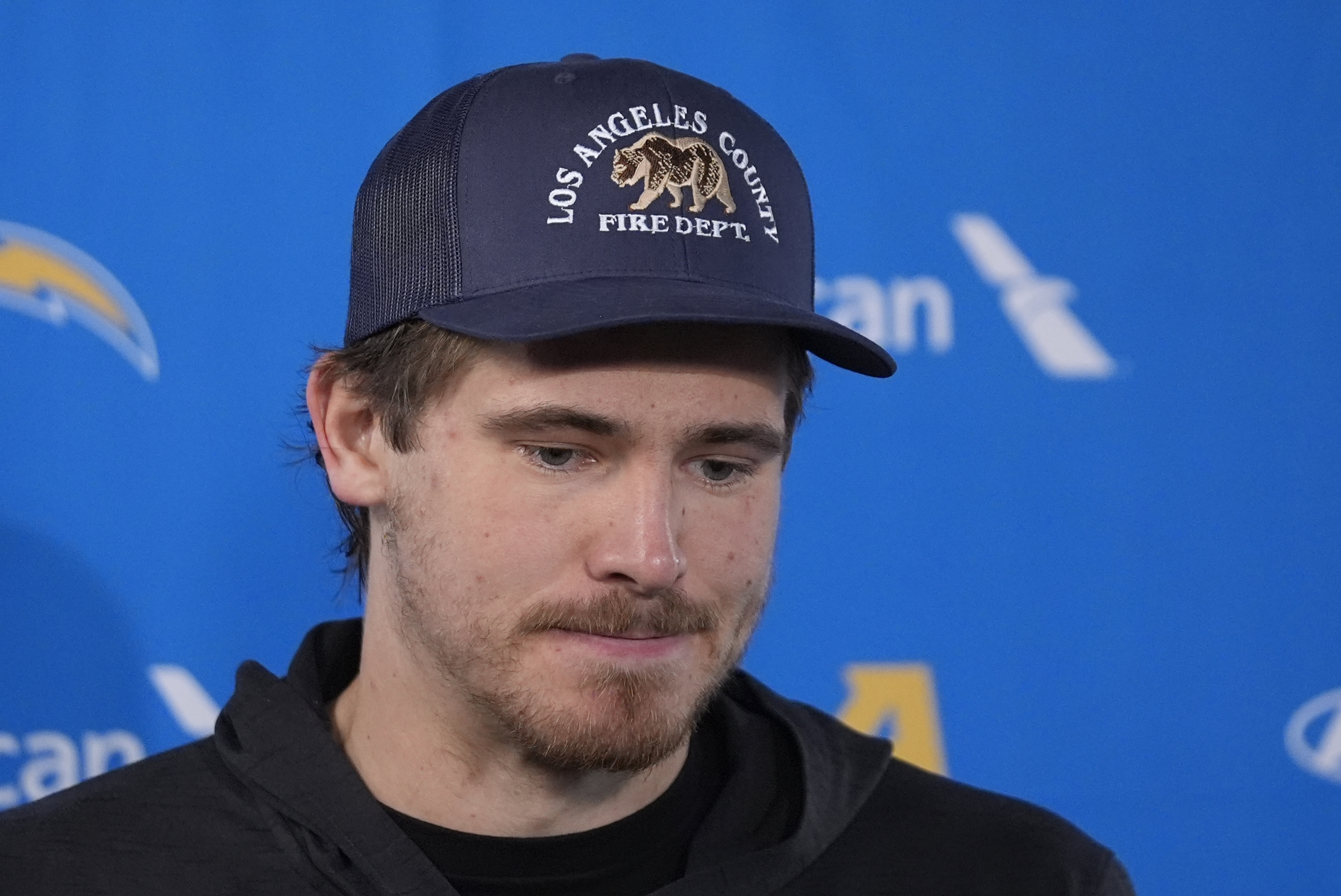 Los Angeles Chargers quarterback Justin Herbert listens to a question during a news conference after an NFL wild-card playoff football game against the Houston Texans Saturday, Jan. 11, 2025, in Houston. The Texans won 32-12.