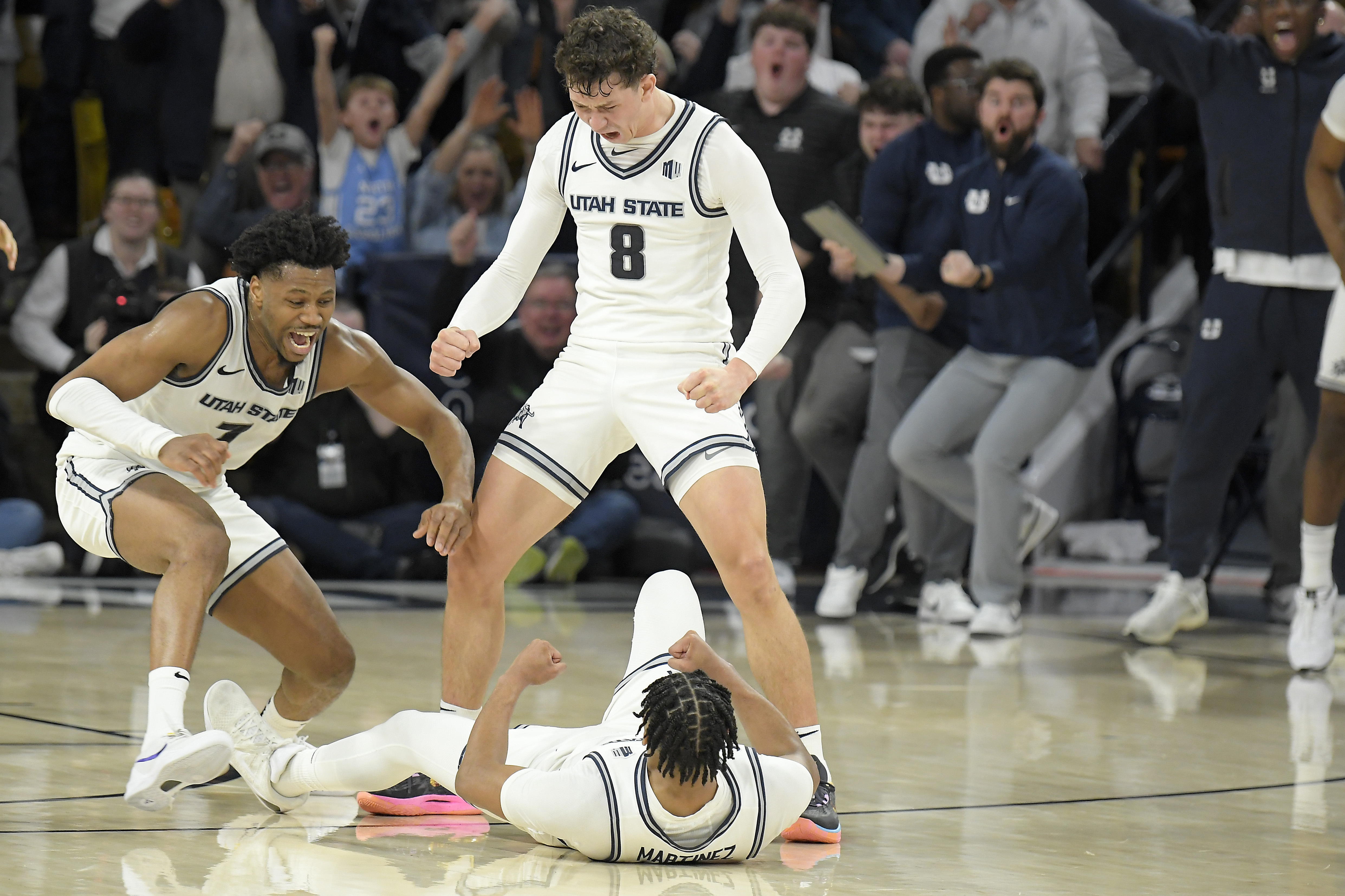 Martinez has 4-point play with 7 seconds left, No. 25 Utah State rallies to beat Boise State 81-79