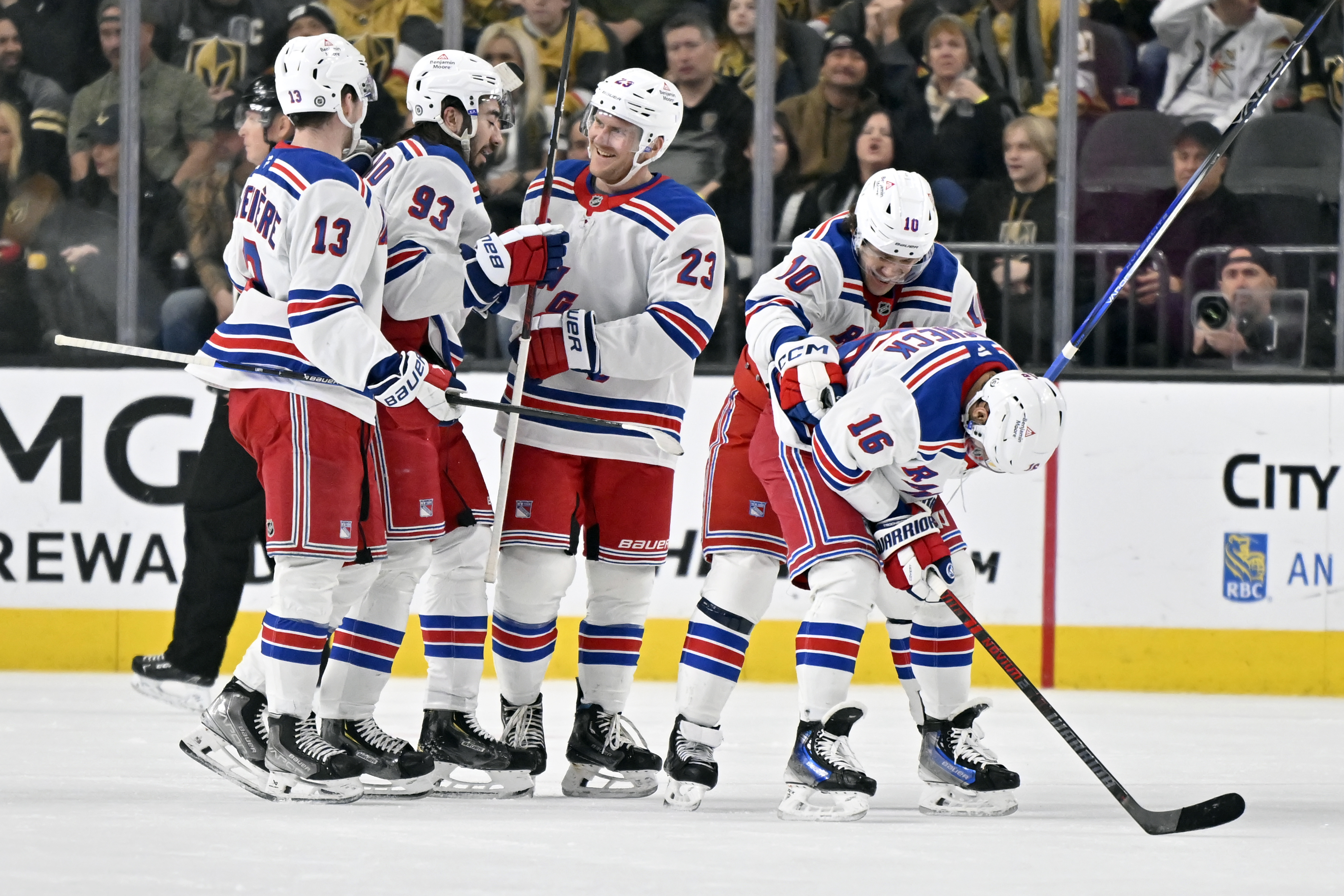 The New York Rangers celebrate after a goal by center Vincent Trocheck's (16) against the Vegas Golden Knights during the second period of an NHL hockey game Saturday, Jan. 11, 2025, in Las Vegas.