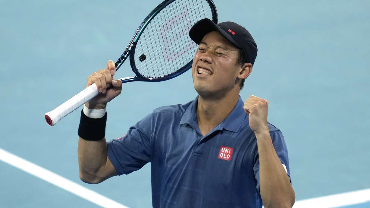 Kei Nishikori of Japan reacts after defeating Thiago Monteiro of Brazil during their first round match at the Australian Open tennis championship in Melbourne, Australia, Sunday, Jan. 12, 2025.