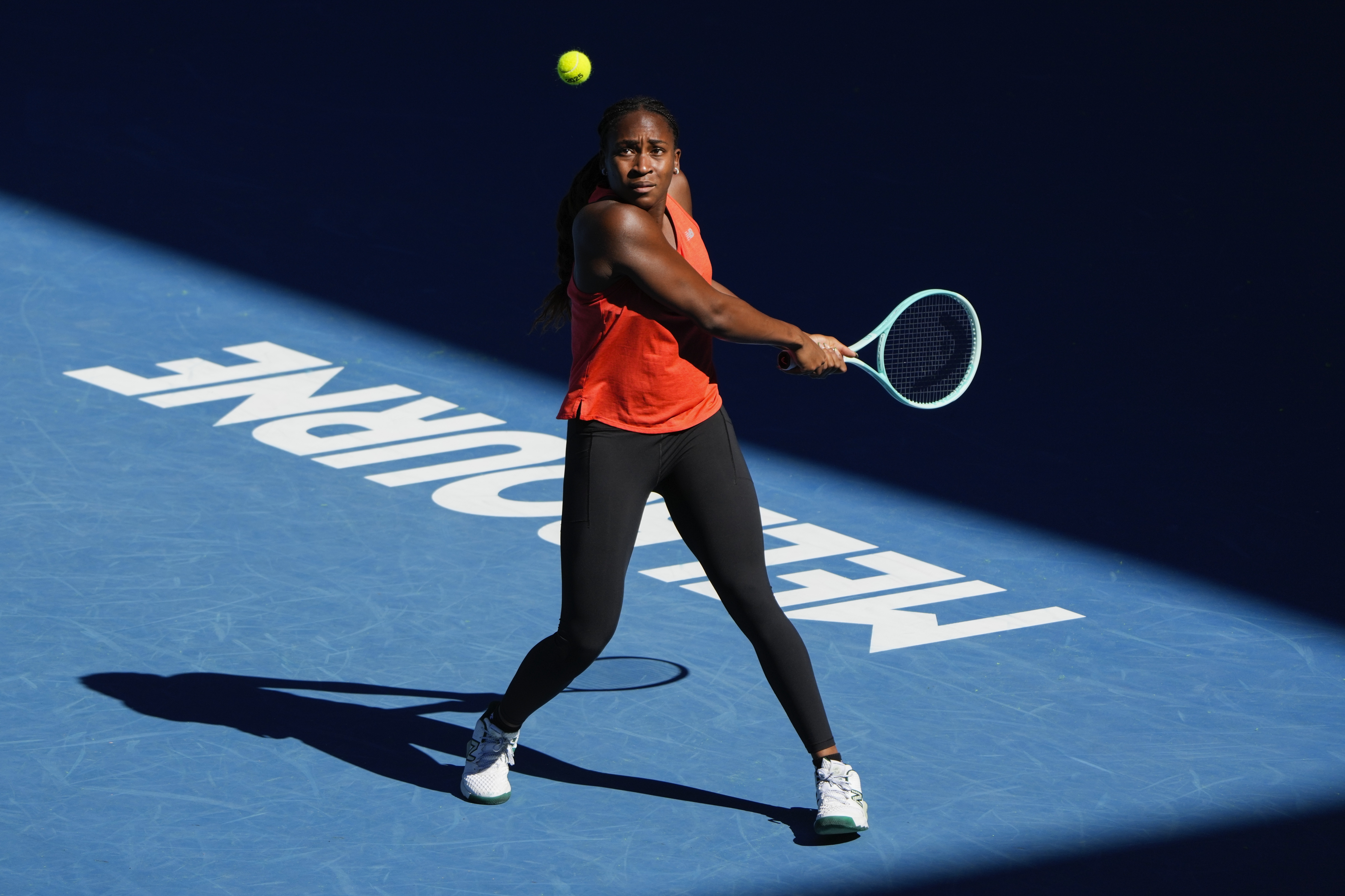 Coco Gauff of the United States plays a backhand return during a practice session ahead of the Australian Open tennis championship in Melbourne, Australia, Saturday, Jan. 11, 2025.