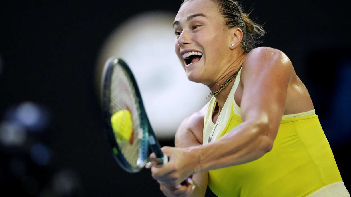 Aryna Sabalenka of Belarus plays a backhand return to Sloane Stephens of the U.S. during their first round match at the Australian Open tennis championship in Melbourne, Australia, Sunday, Jan. 12, 2025.