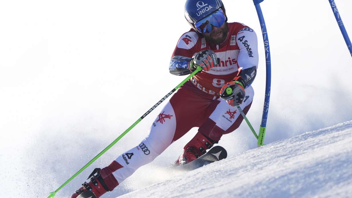 Austria's Marco Schwarz speeds down the course during an alpine ski, men's World Cup giant slalom race, in Adelboden, Switzerland, Sunday, Jan. 12, 2025.