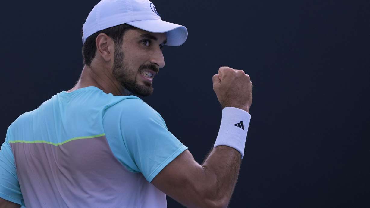 Hady Habib of Lebanon reacts after winning a point against Bu Yunchaokete of China during their first round match at the Australian Open tennis championship in Melbourne, Australia, Sunday, Jan. 12, 2025.