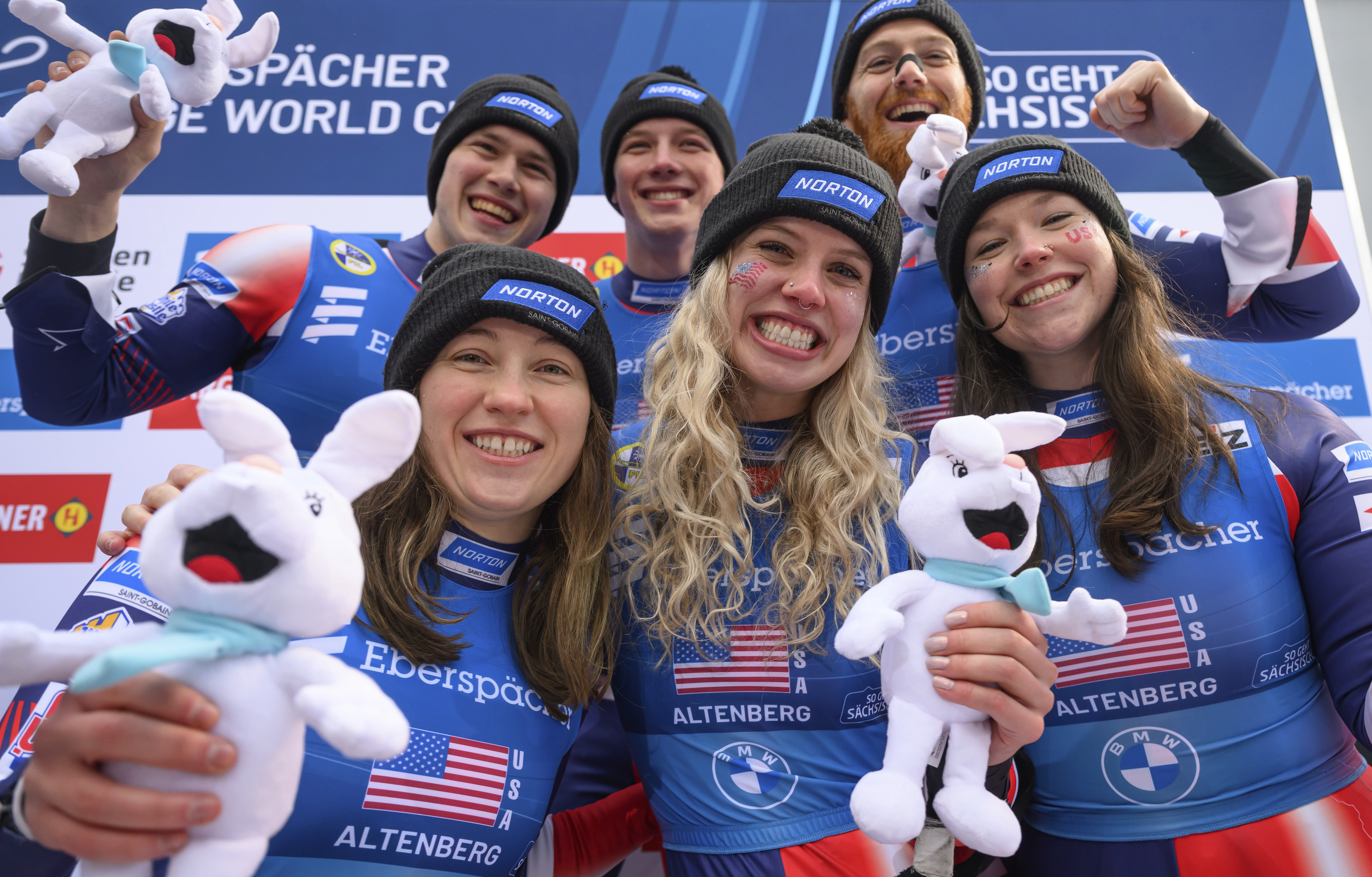 Front row from left, Sophia Kirkby, Chevonne Chelsea Forgan, and Ashley Farquharson, rear row from left, Ansel Haugsjaa, Marcus Mueller and Jonathan Gustafson of Team USA celebrate their 3rd place in the Team Relay at the Luge World Cup in Altenberg, Germany, Sunday Jan. 12, 2025. 