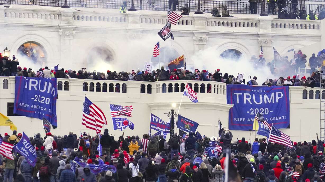Rioters are seen at the U.S. Capitol on Jan. 6, 2021, in Washington. Vice President-elect JD Vance says people responsible for the violence during the Capitol riot "obviously" should not be pardoned.