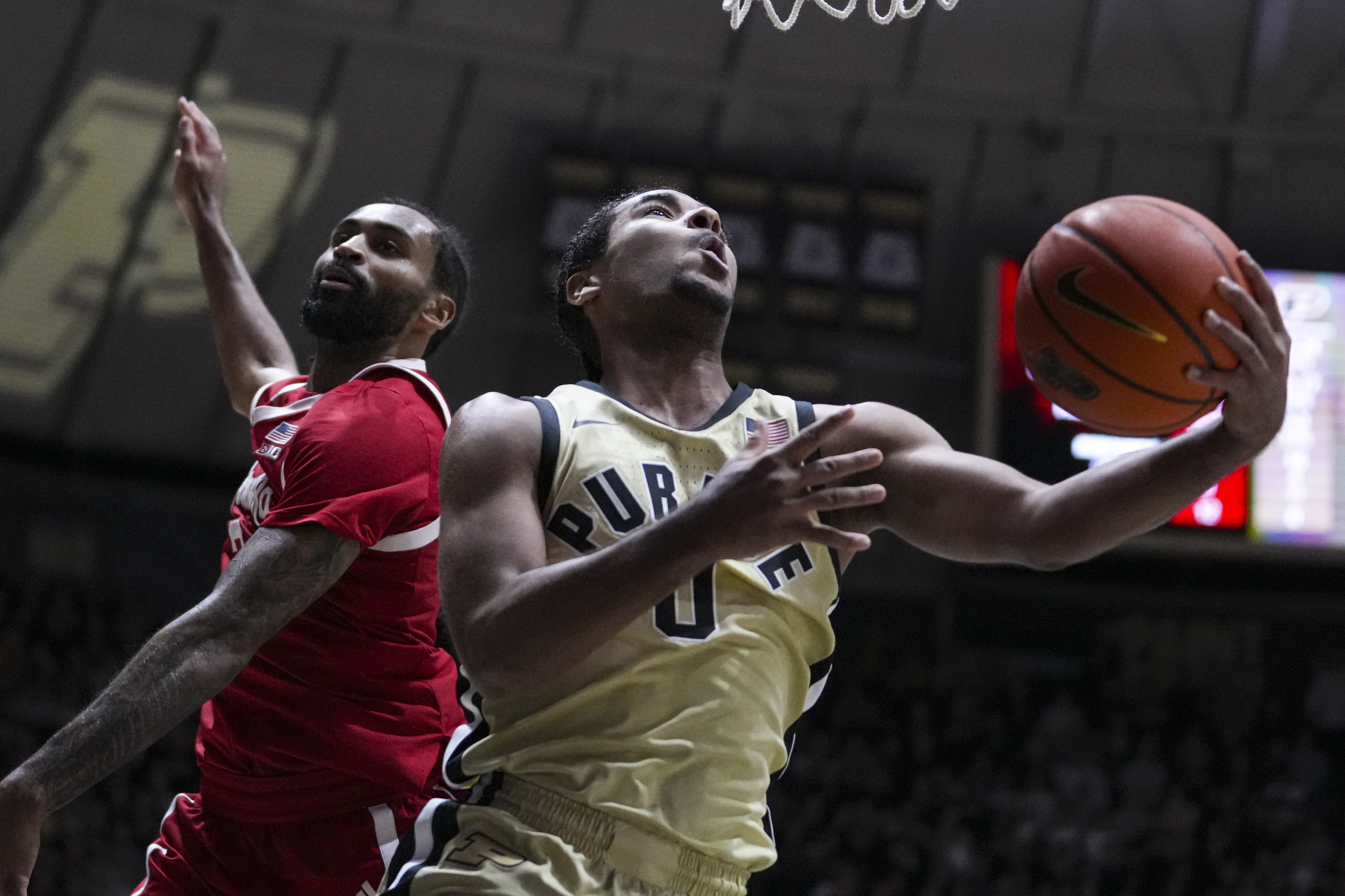 Purdue guard C.J. Cox (0) shoots around Nebraska guard Brice Williams (3) in the second half of an NCAA college basketball game in West Lafayette, Ind., Sunday, Jan. 12, 2025.