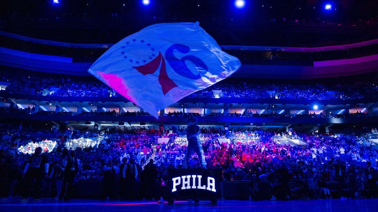 FILE - Philadelphia 76ers mascot Franklin waves the flag during pre-game introductions prior to the NBA basketball game against the Brooklyn Nets, April 14, 2024, in Philadelphia.