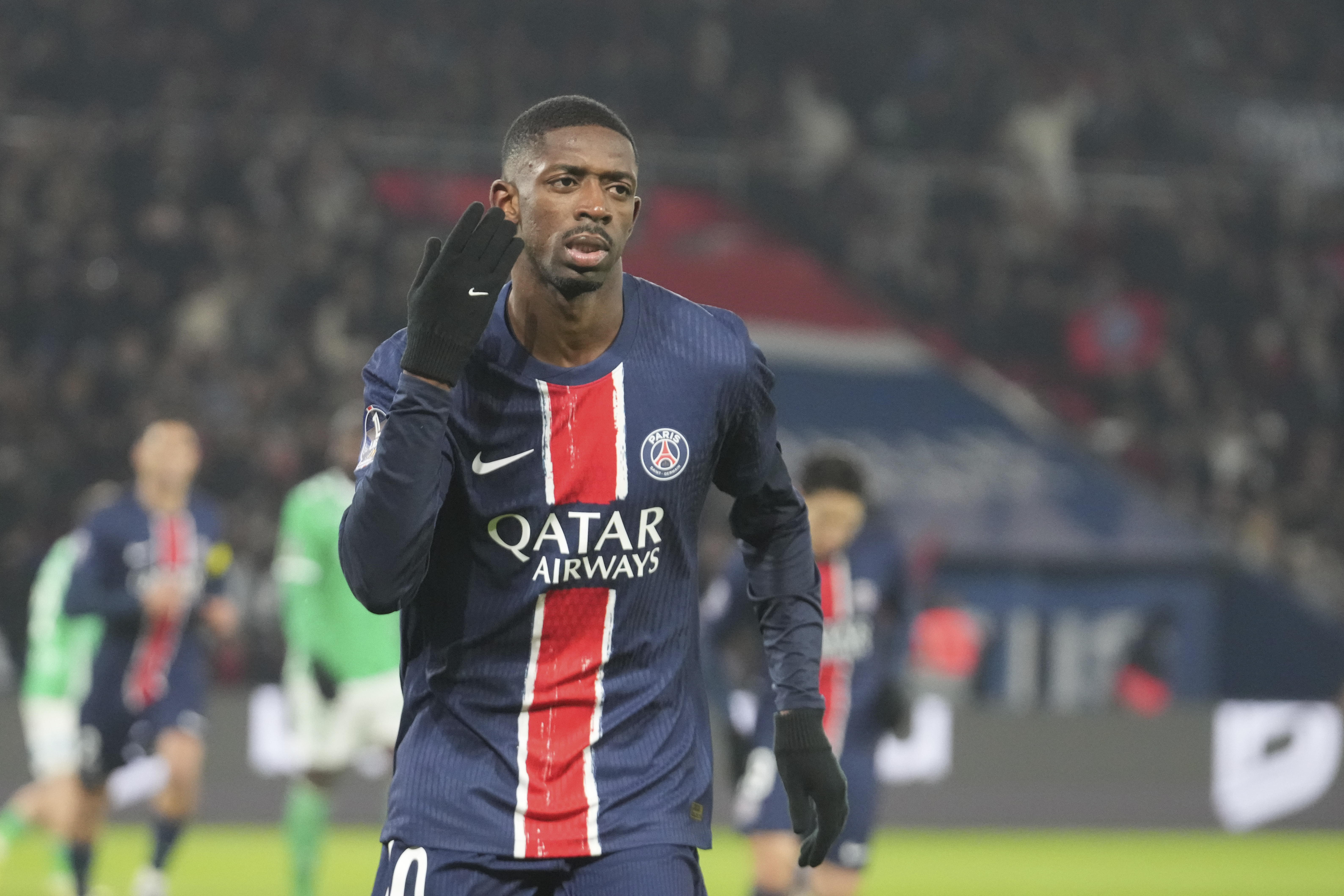 PSG's Ousmane Dembele celebrates after scoring his side's second goal during the French League One soccer match between Paris Saint-Germain and Saint-Etienne at the Parc des Princes stadium in Paris, France, Sunday, Jan. 12, 2025.