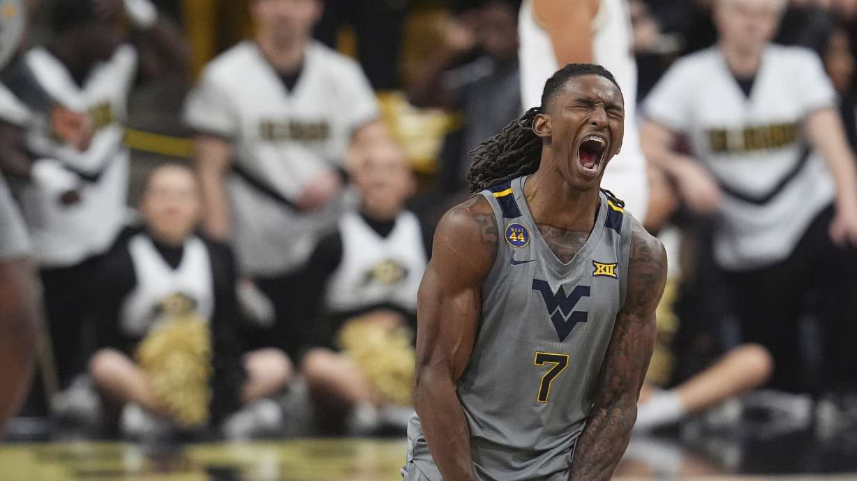 West Virginia guard Javon Small reacts after scoring a 3-point basket against Colorado in the second half of an NCAA college basketball game Sunday, Jan. 12, 2025, in Boulder, Colo.