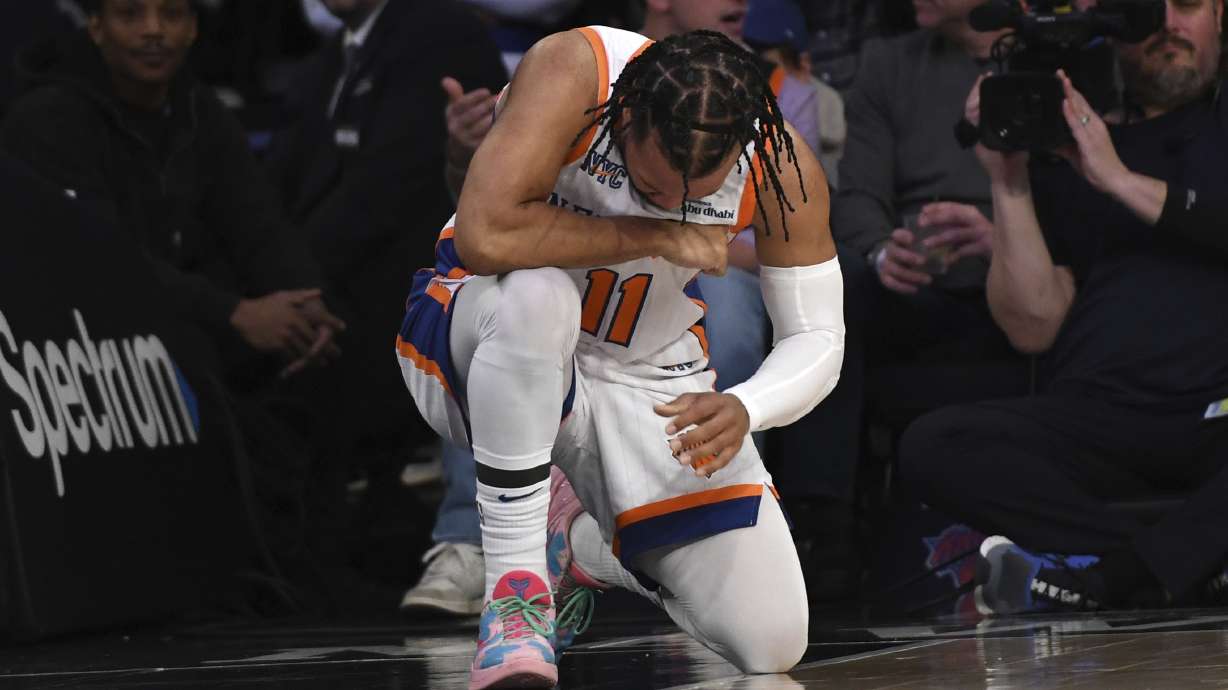 New York Knicks' Jalen Brunson reacts after getting knocked over during the second half of an NBA basketball game against the Milwaukee Bucks, Sunday, Jan. 12, 2025, in New York.