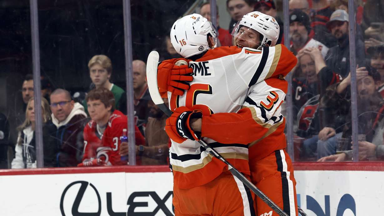 Anaheim Ducks' Jansen Harkins, right, is congratulated agfter his goal by teammate Ryan Strome (16) during the first period of an NHL hockey game against the Carolina Hurricanes in Raleigh, N.C., Sunday, Jan. 12, 2025.