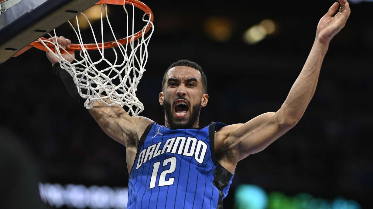 Orlando Magic guard Trevelin Queen reacts after dunking against the Philadelphia 76ers during the second half of an NBA basketball game, Sunday, Jan. 12, 2025, in Orlando, Fla.