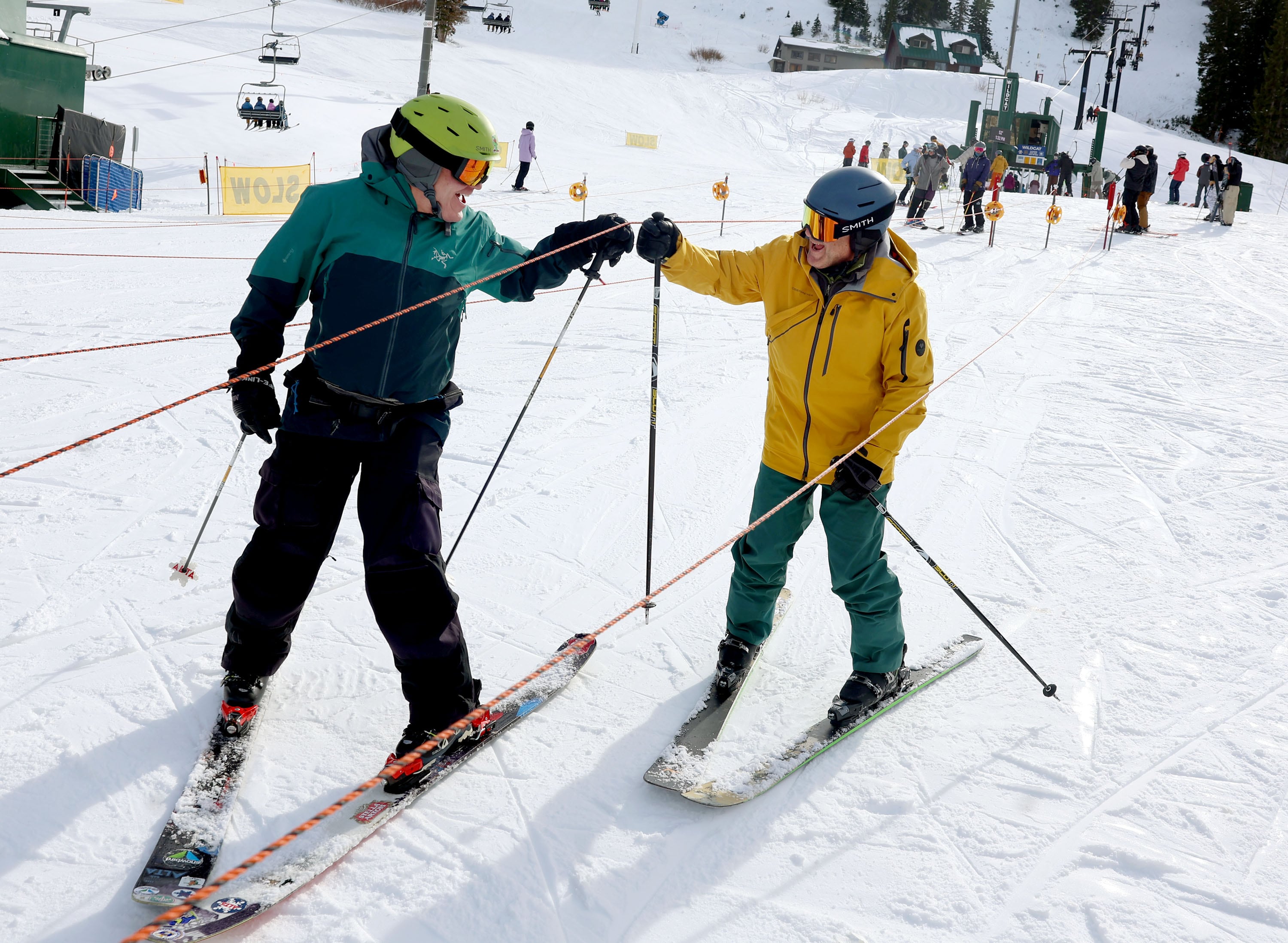 Jason Ehrhart, of Cottonwood Heights, and Joe Prokop, of Salt Lake City, celebrate opening day at Alta Ski Area in Little Cottonwood Canyon on Nov. 22, 2024.