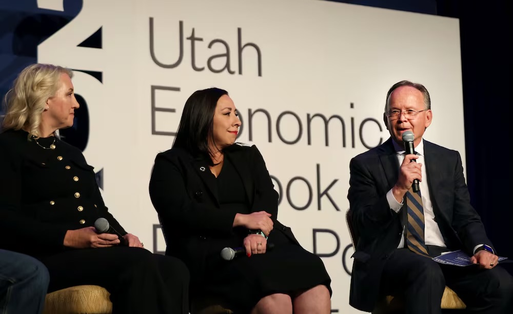 Rep. Karianne Lisonbee, Rep. Angela Romero and Senate President J. Stuart Adams speak at the 2025 Utah Economic Outlook and Public Policy Summit on Friday. Business leaders are bringing their priorities to the state Legislature.