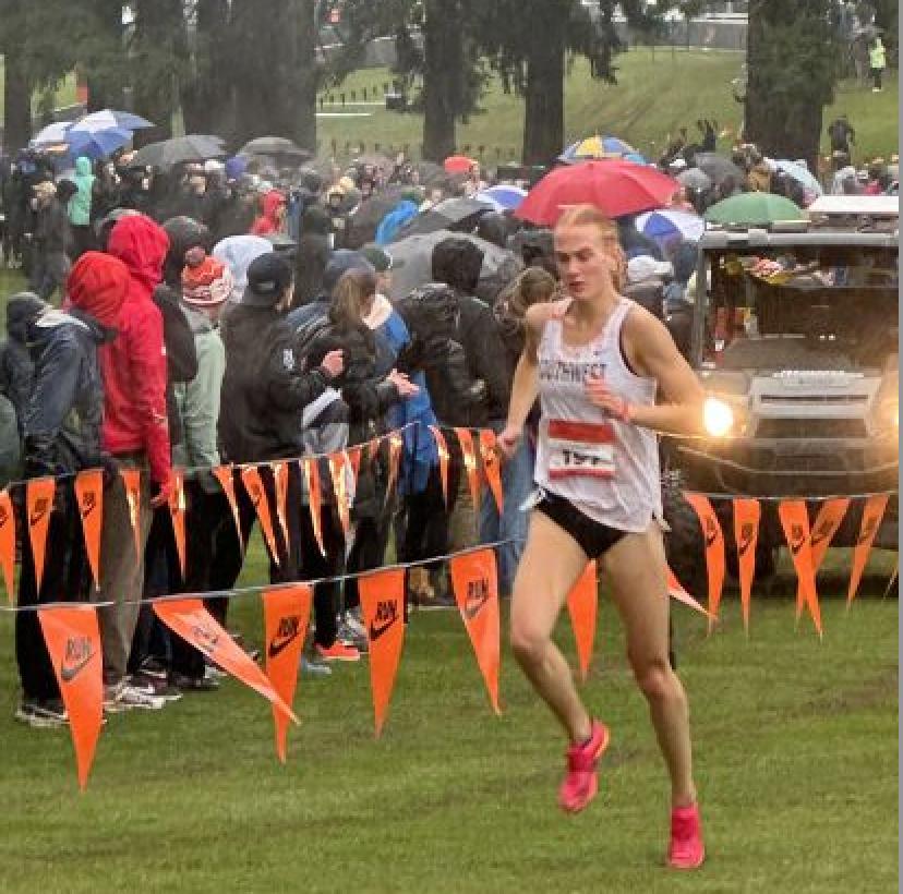 Timpview High School senior Jane Hedegren set a new course record of 16:37.8 at the Nike Cross Nationals girls' championship race in Portland, Oregon.