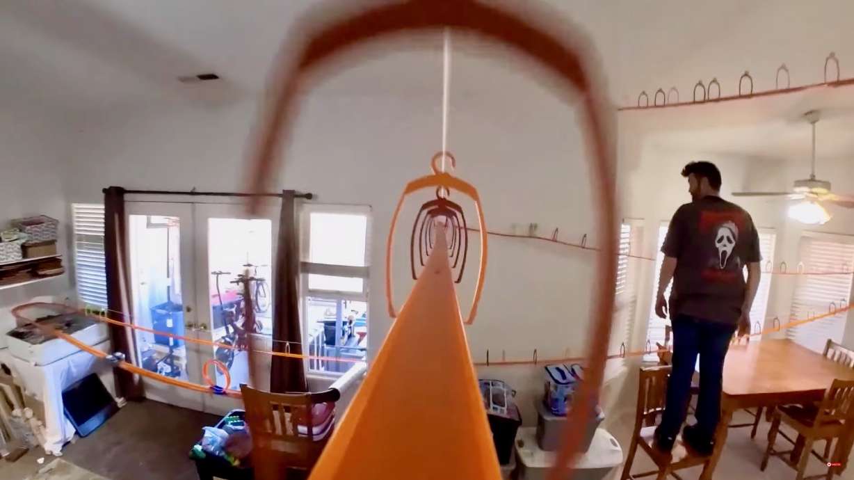 BrutalMenace, a YouTuber who posts videos of Hot Wheels careening down his elaborate track systems, awaits a descending auto in one of his videos.
