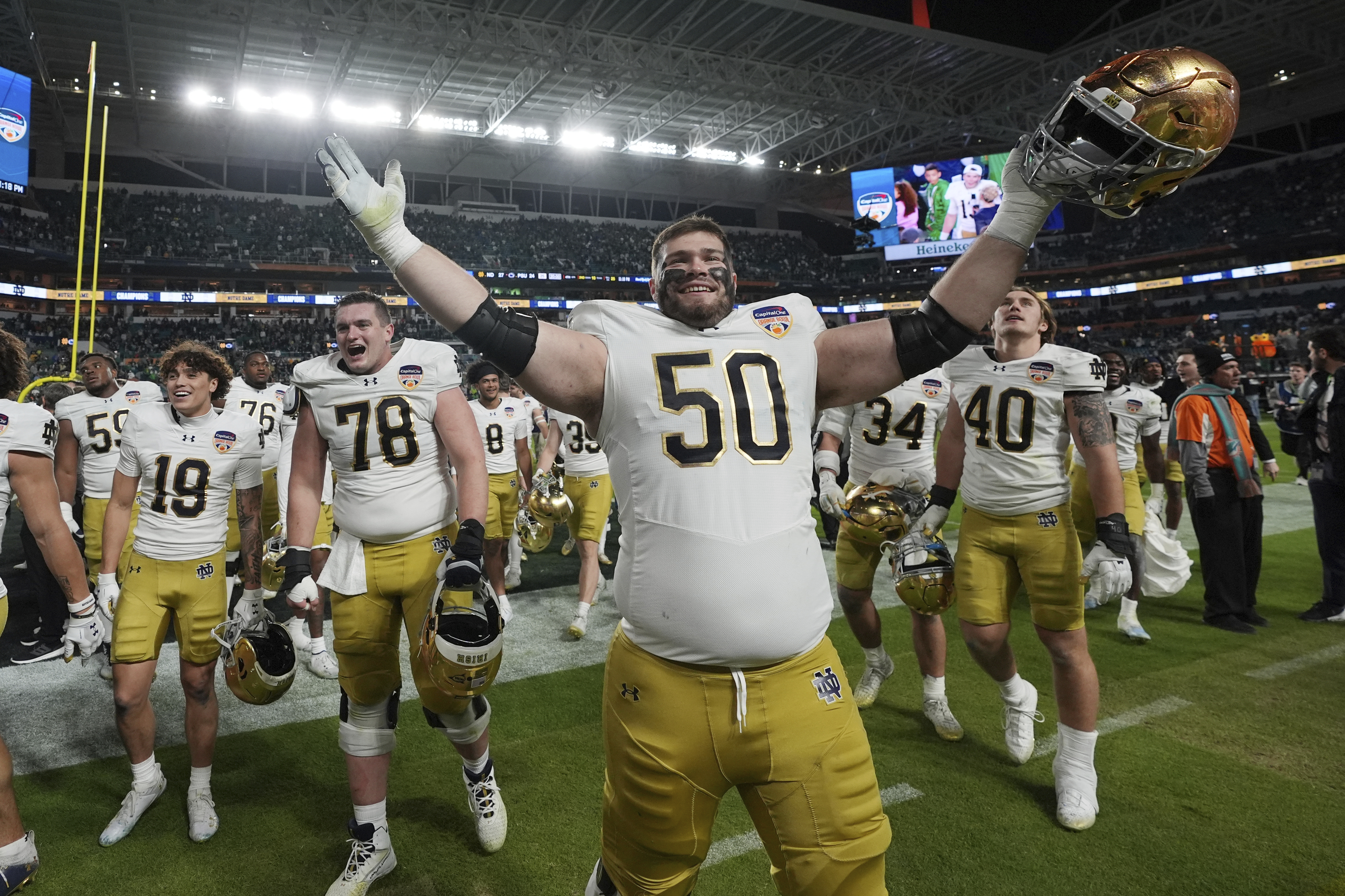 Notre Dame offensive lineman Rocco Spindler (50) celebrates at the end of the Orange Bowl College Football Playoff semifinal game against Penn State, Thursday, Jan. 9, 2025, in Miami Gardens, Fla.