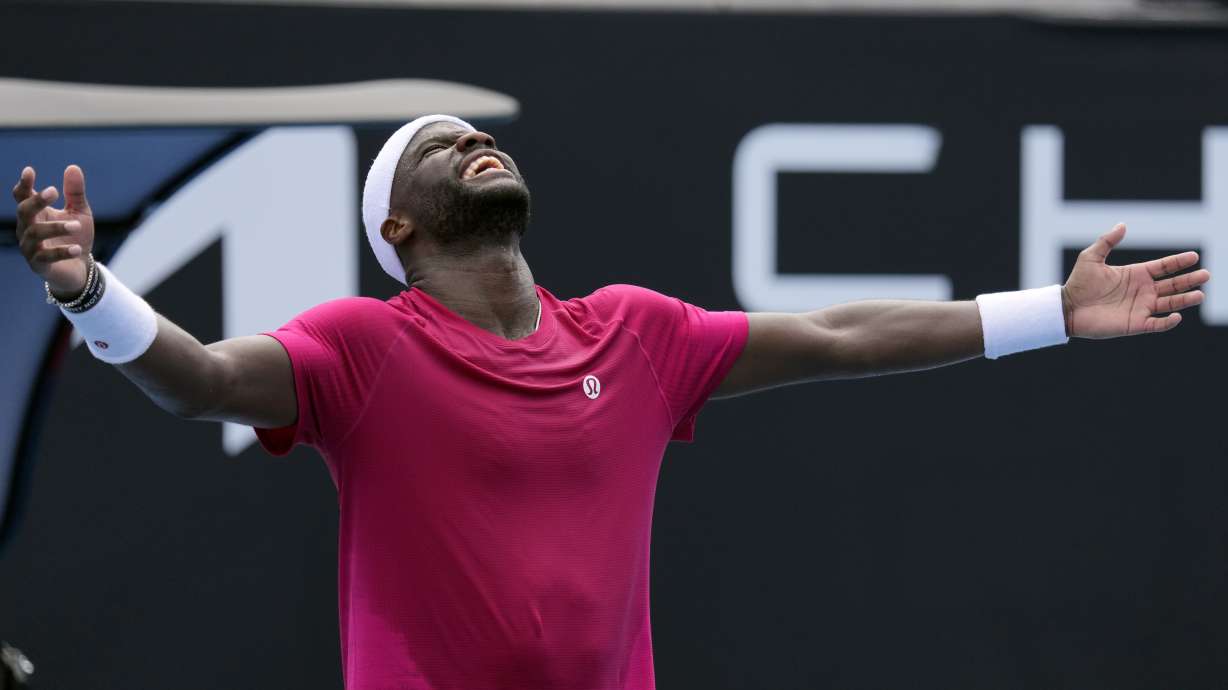 Frances Tiafoe of the U.S. celebrates after defeating Arthur Rinderknech of France in their first round match at the Australian Open tennis championship in Melbourne, Australia, Monday, Jan. 13, 2025.