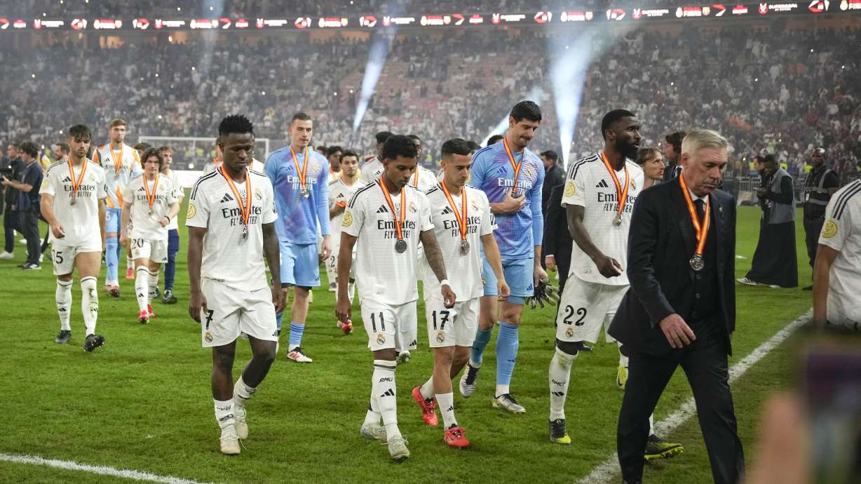 Real Madrid players leave the pitch after the final soccer match between Real Madrid and Barcelona at King Abdullah Stadium in Jeddah, Saudi Arabia, Monday, Jan. 13, 2025.