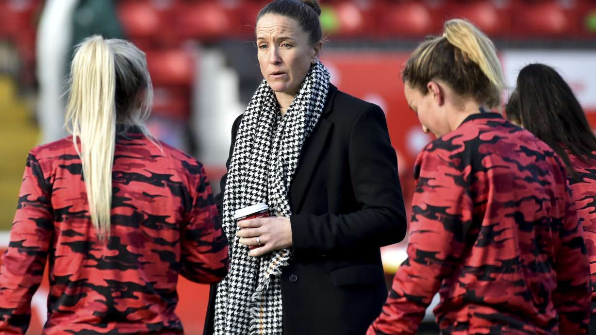 FILE - Manchester United manager Casey Stoney talks to her players during their English Women's Super League soccer match with Aston Villa in Walsall, England, Dec. 5, 2020.