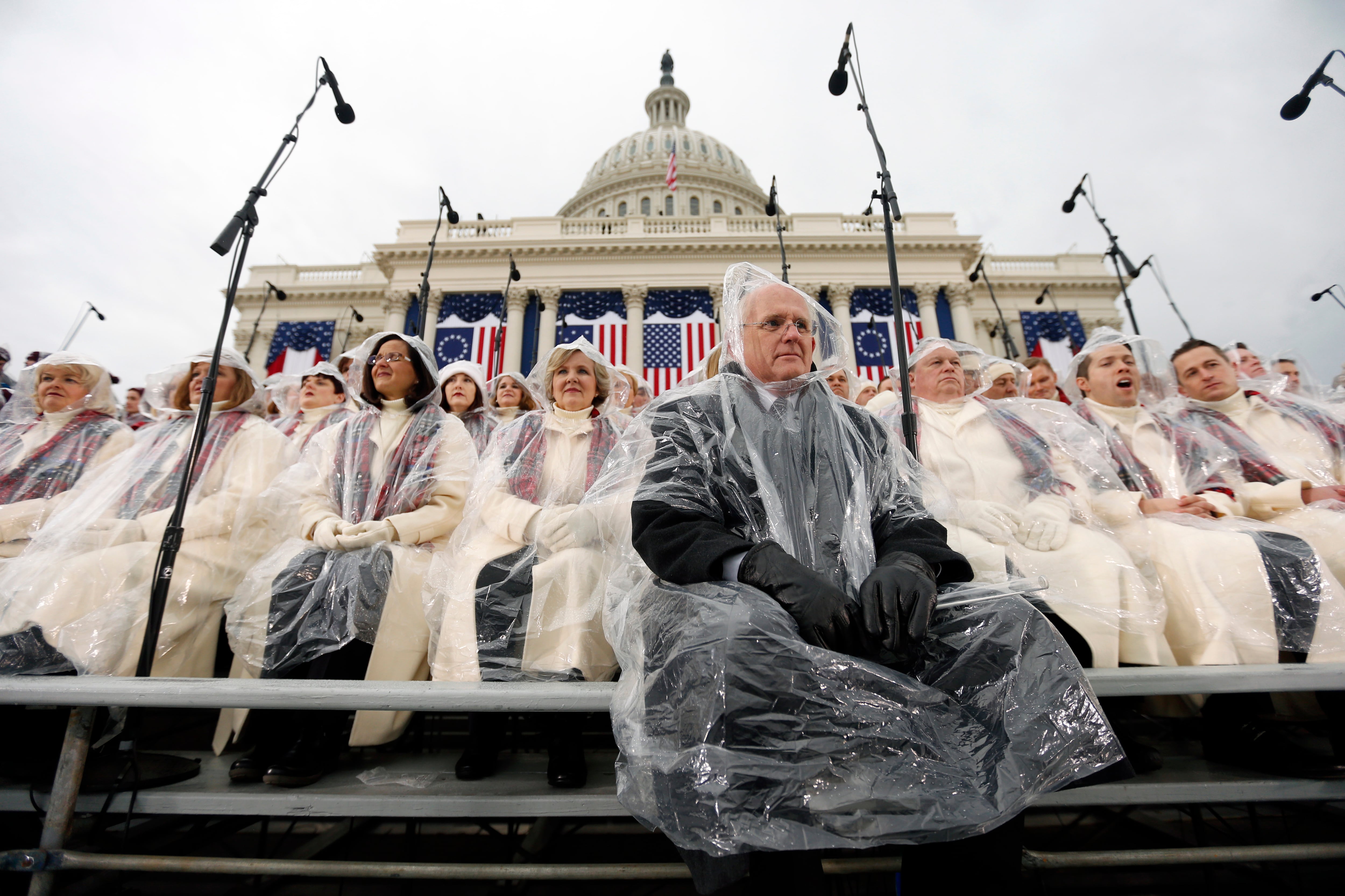 Members of the Mormon Tabernacle Choir sit in the rain waiting for the swearing in of Donald Trump as the 45th president of the United States to begin during the 58th Presidential Inauguration at the U.S. Capitol in Washington, Jan. 20.