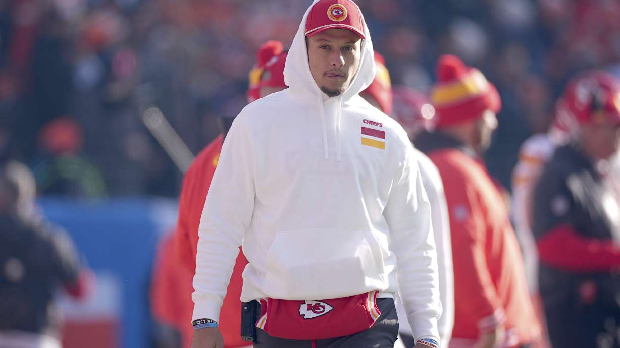 Kansas City Chiefs quarterback Patrick Mahomes watches from the sidelines during the first half of an NFL football game against the Denver Broncos Sunday, Jan. 5, 2025, in Denver.