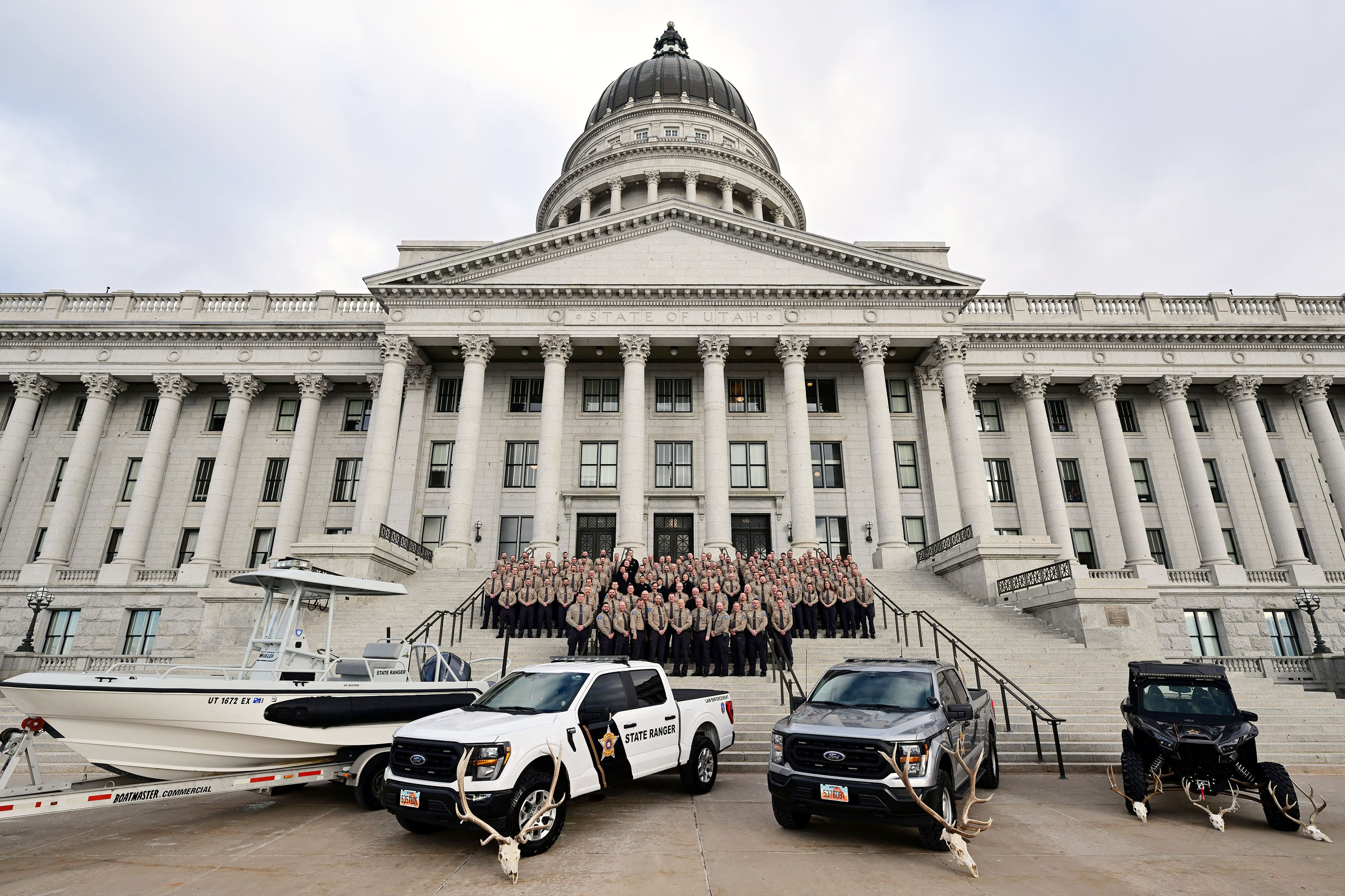 Members of the newly created Utah Division of Law Enforcement line up for a group photo on the south steps outside the state Capitol after being sworn in on Monday.