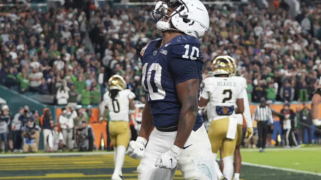 Penn State running back Nicholas Singleton (10) celebrates after scoring a touchdown during the second half of the Orange Bowl College Football Playoff semifinal game against Notre Dame, Thursday, Jan. 9, 2025, in Miami Gardens, Fla.