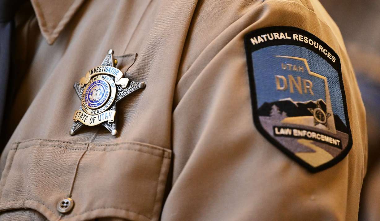 A badge and new patch of the Department of Natural Resource's Utah Division of Law Enforcement on the uniform of one of the members during the swearing-in ceremony at the state Capitol in Salt Lake City on Monday.