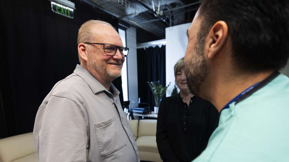 Tom McLelland shakes hands with Dr. Alan Contreras after a press conference announcing the successful transplanting of 489 organs in 2024 by Intermountain Health, at the Kem C. Gardner Transformation Center in Murray on Monday.