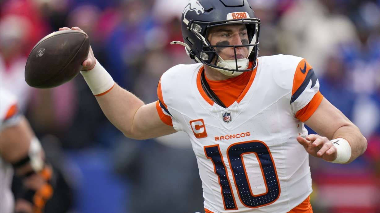 Denver Broncos quarterback Bo Nix (10) passes against the Buffalo Bills during the second quarter of an NFL wild card playoff football game, Sunday, Jan. 12, 2025, in Orchard Park, N.Y.
