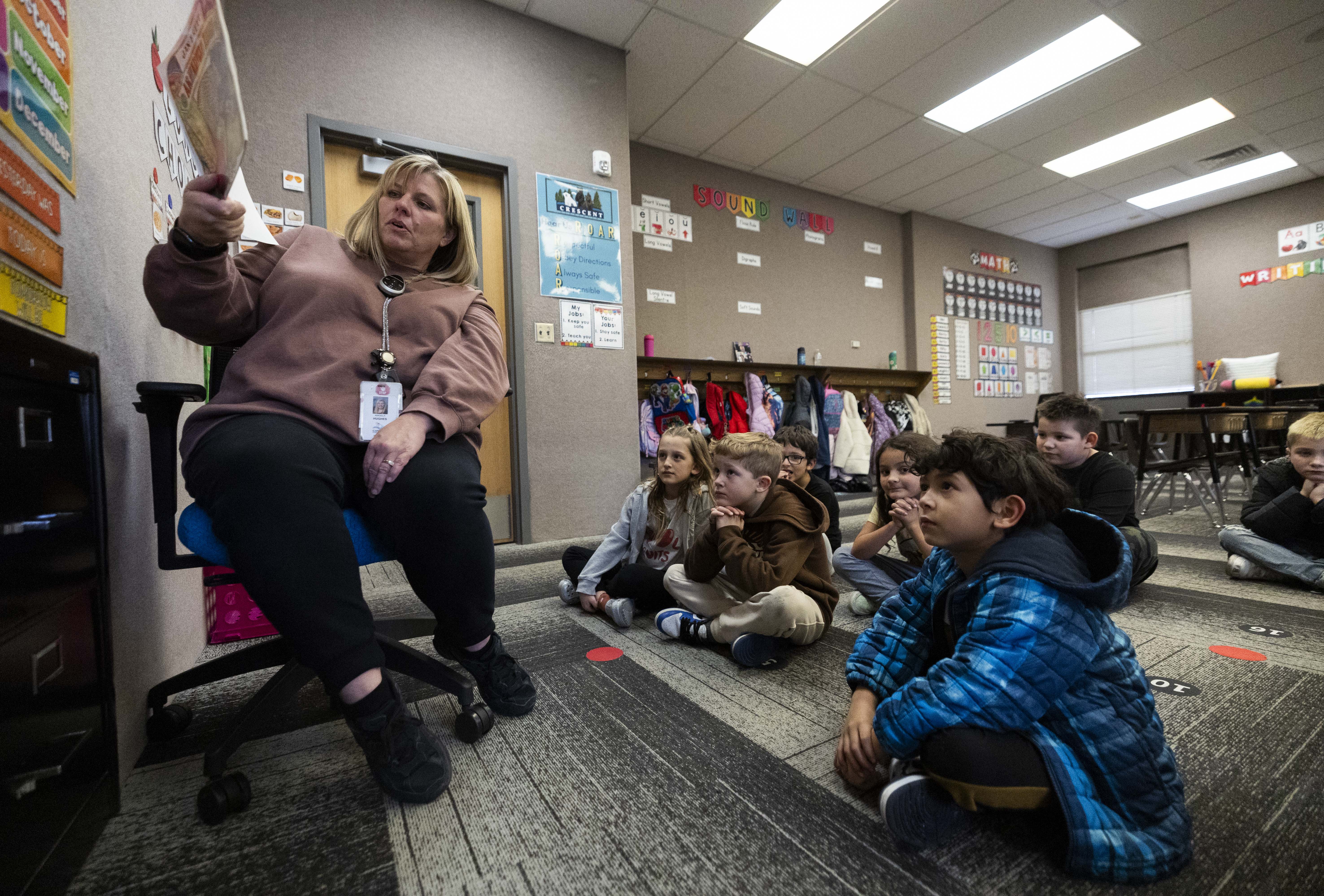 First-grade teacher Angie Thompson reads a book to her students at Crescent Elementary School in Sandy on Monday. Ahead of what's shaping up to be a busy 2025 legislative session in the education realm, the Utah Education Association on Monday unveiled the issues it wants lawmakers to prioritize this year.