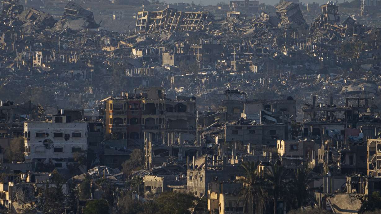 Destroyed buildings are seen inside the Gaza Strip from southern Israel, Monday. Officials say Hamas has accepted a draft agreement for a ceasefire in the Gaza Strip and the release of dozens of hostages.