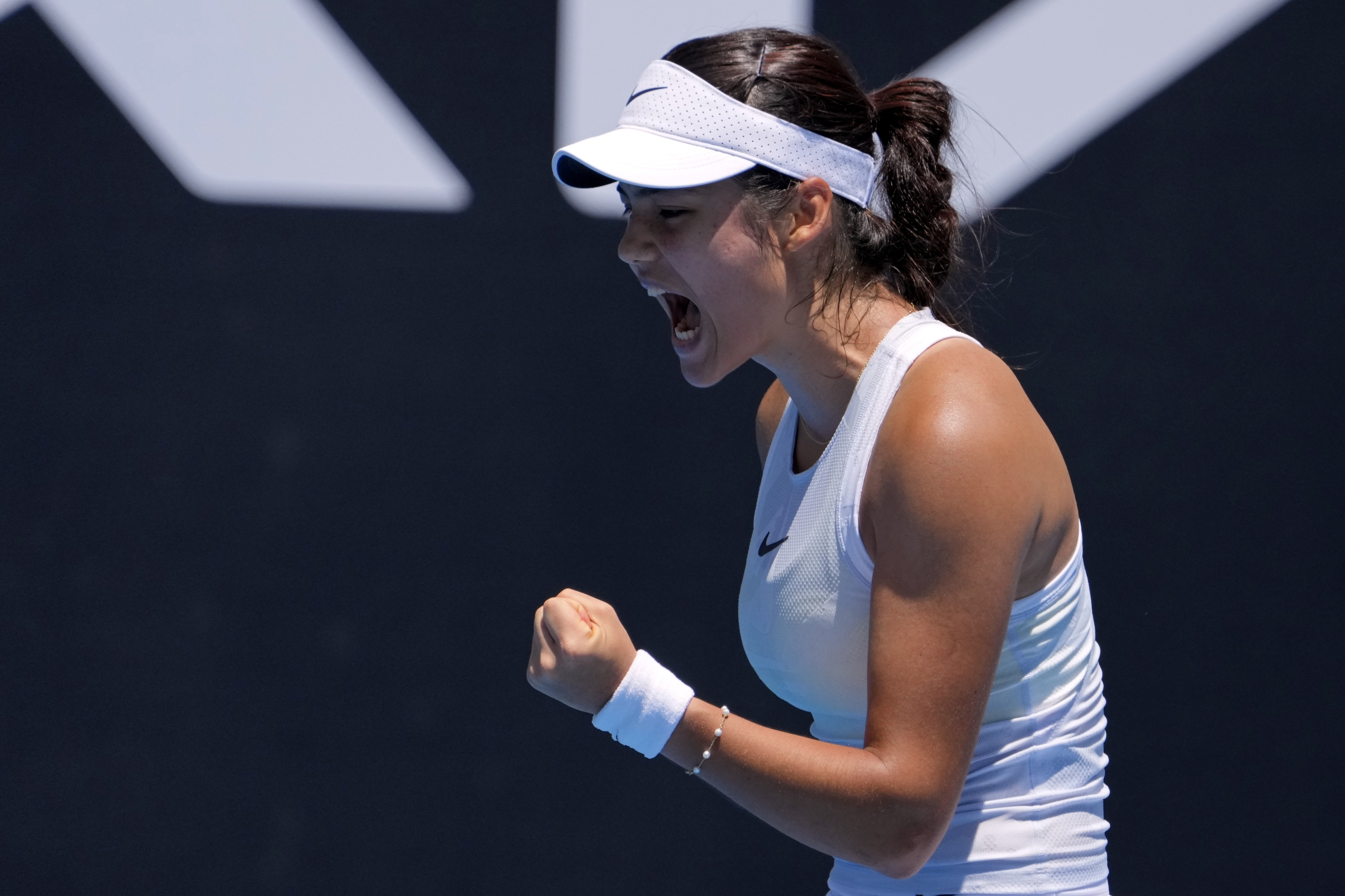 Emma Raducanu of Britain reacts after winning a point against Ekaterina Alexandrova of Russia during their first round match at the Australian Open tennis championship in Melbourne, Australia, Tuesday, Jan. 14, 2025.