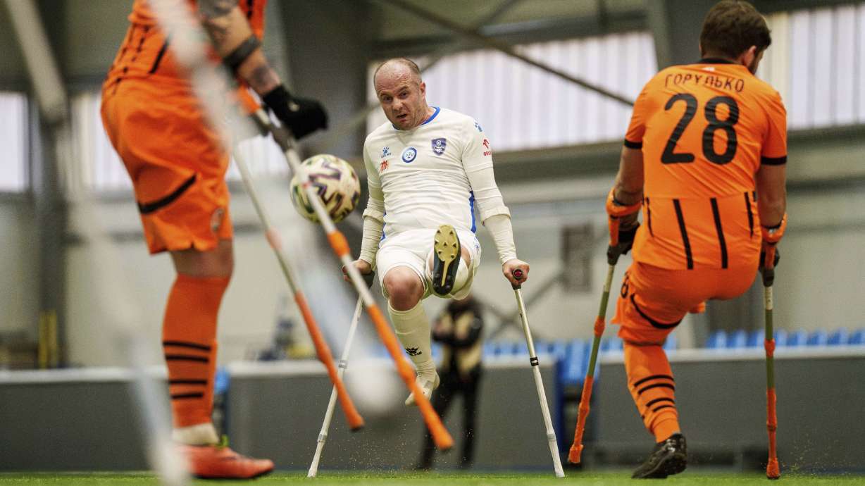 Soccer players of Shakhtar Stalevi and Pokrova FC-2 play during Ukraine's first soccer tournament for war-wounded amputees in Kyiv, Ukraine, Jan. 11, 2024.