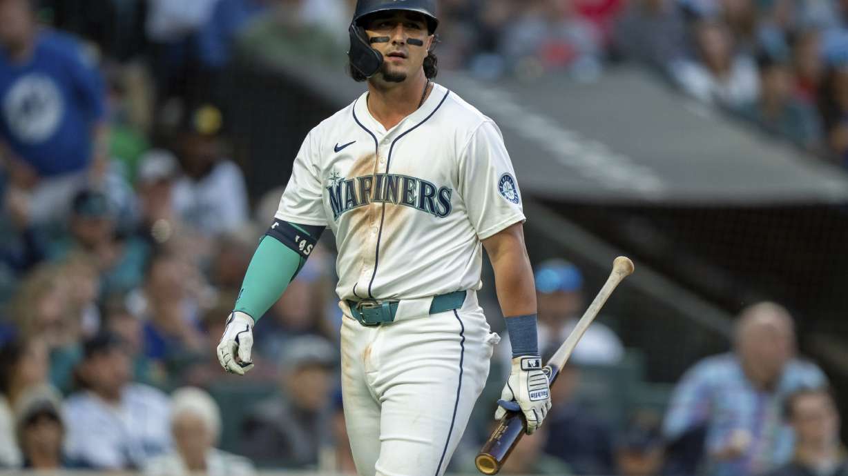 FILE - Seattle Mariners' Josh Rojas walks off the field after an at-bat during a baseball game against the Los Angeles Angels, July 23, 2024, in Seattle.