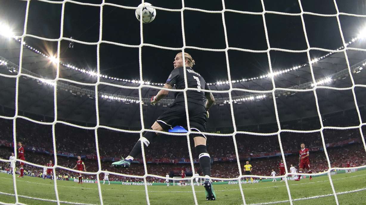 FILE - Liverpool goalkeeper Loris Karius can't stop the ball shot by Real Madrid's Gareth Bale during the Champions League Final soccer match between Real Madrid and Liverpool at the Olimpiyskiy Stadium in Kyiv, Ukraine, Saturday, May 26, 2018.