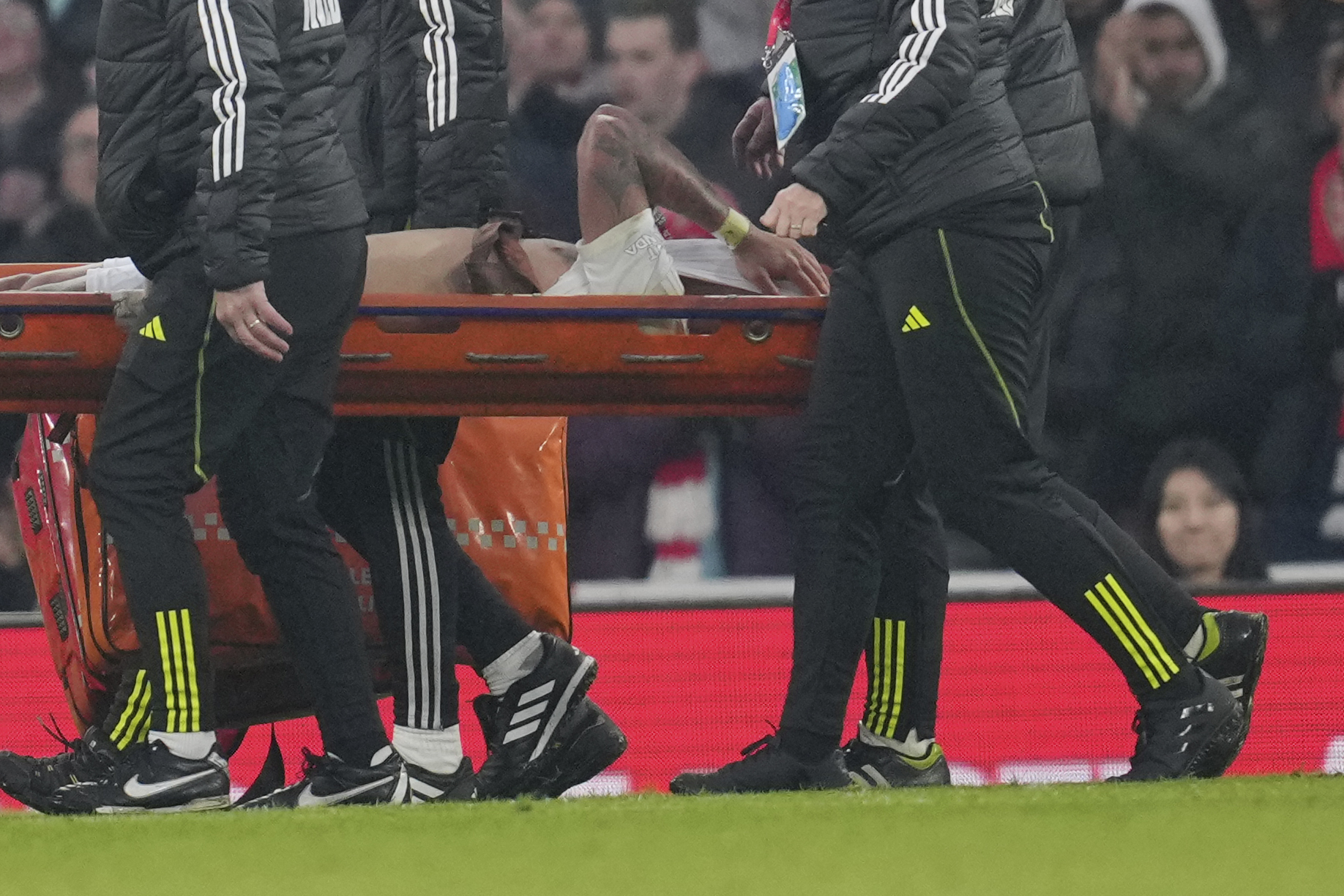 Arsenal's Gabriel Jesus is taken from the pitch by medical staff on a stretcher after injuring during the English FA Cup soccer match between Arsenal and Manchester United at the Emirates stadium in London, Sunday, Jan. 12, 2025.