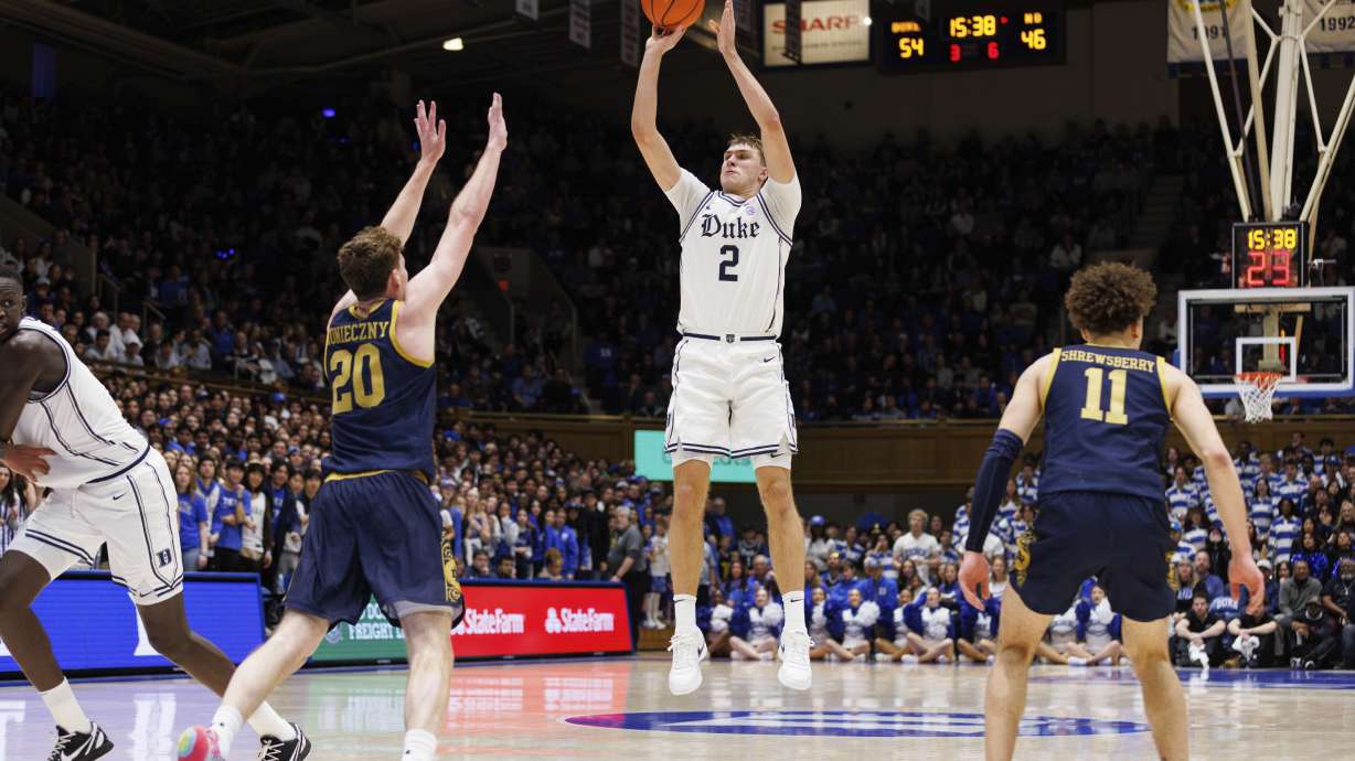 Duke's Cooper Flagg (2) attempts a shot over Notre Dame's J.R. Konieczny (20) during the second half of an NCAA college basketball game in Durham, N.C., Saturday, Jan. 11, 2025.