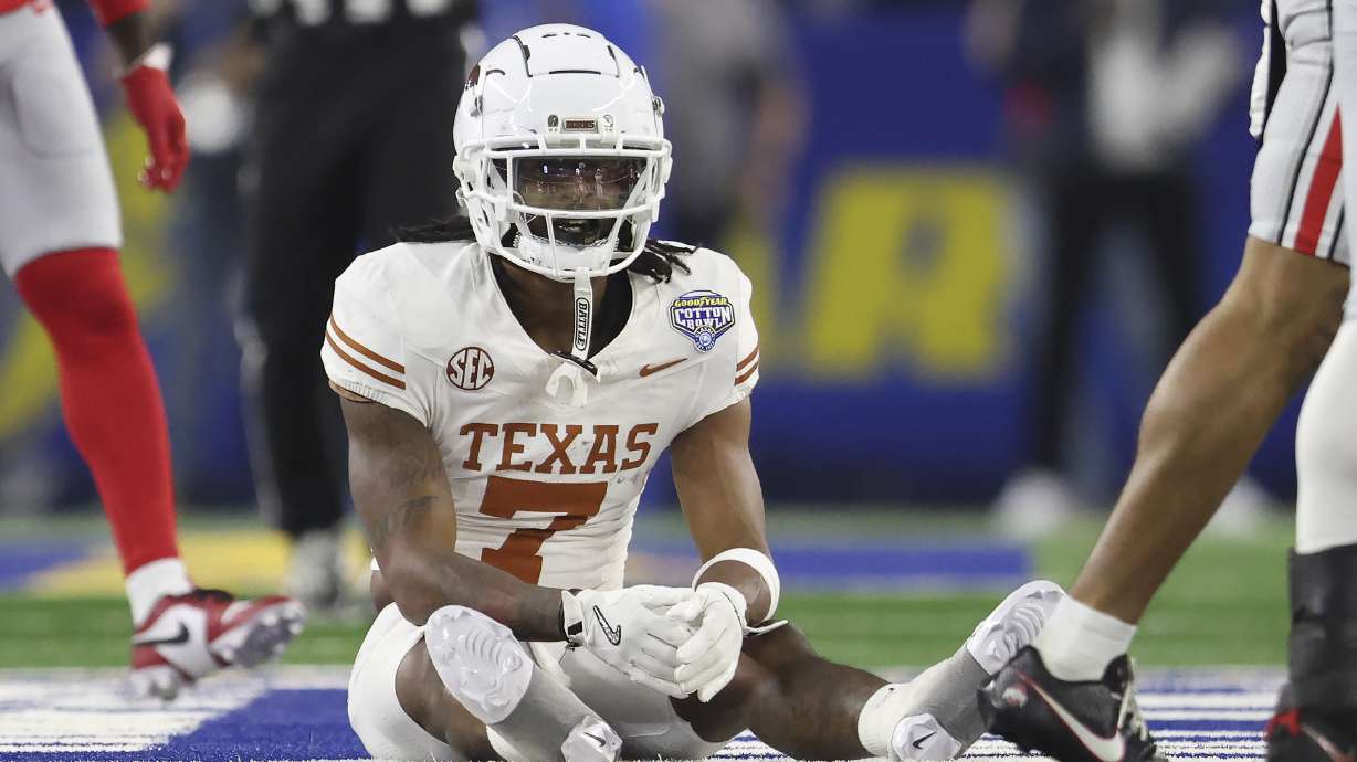 Texas wide receiver Isaiah Bond (7) reacts after an incomplete pass during the first half of the Cotton Bowl College Football Playoff semifinal game against Ohio State, Friday, Jan. 10, 2025, in Arlington, Texas.