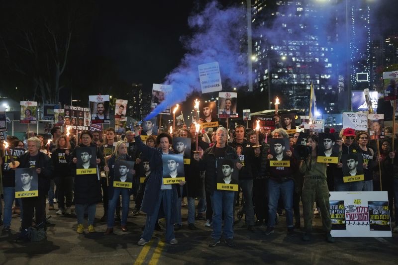 Demonstrators hold torches during a protest calling for the immediate release of the hostages held in the Gaza Strip by the Hamas militant group in Tel Aviv, Israel, on Monday.