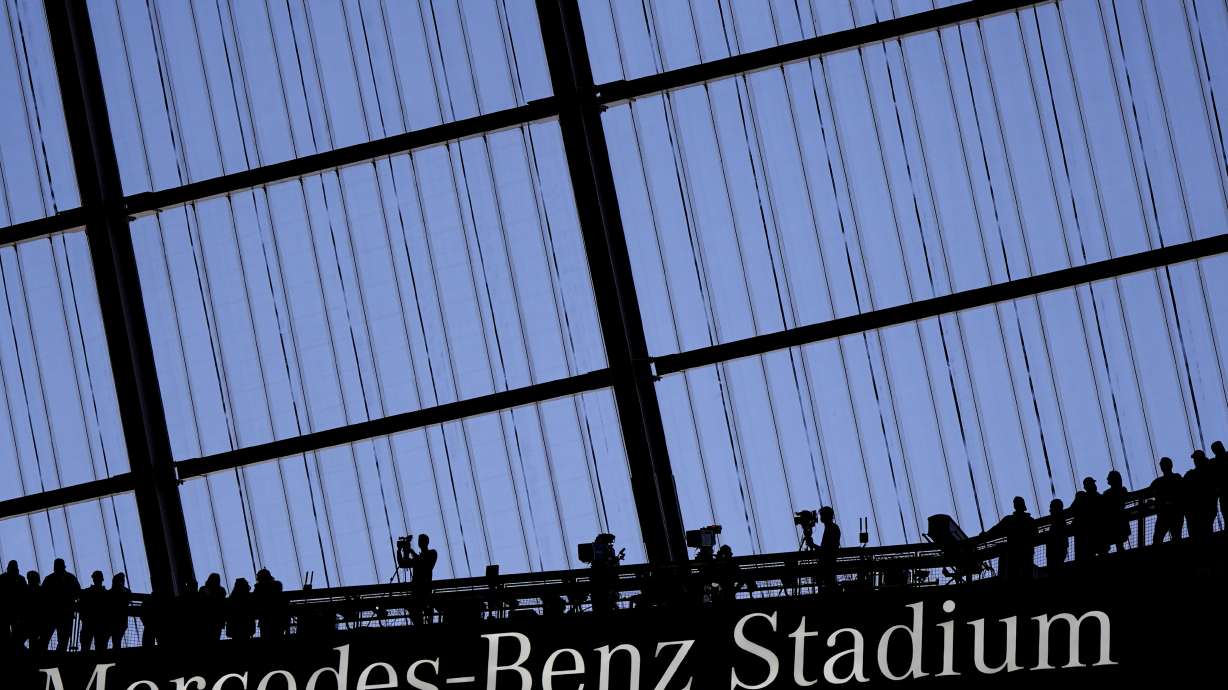 FILE - Fans watch an NFL football game at the Mercedes-Benz Stadium in Atlanta, Dec. 1, 2024.