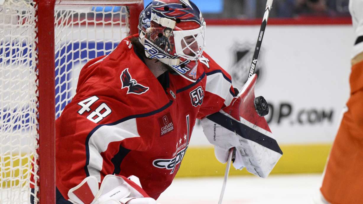 Washington Capitals goaltender Logan Thompson stops the puck during the second period of an NHL hockey game against the Anaheim Ducks, Tuesday, Jan. 14, 2025, in Washington.