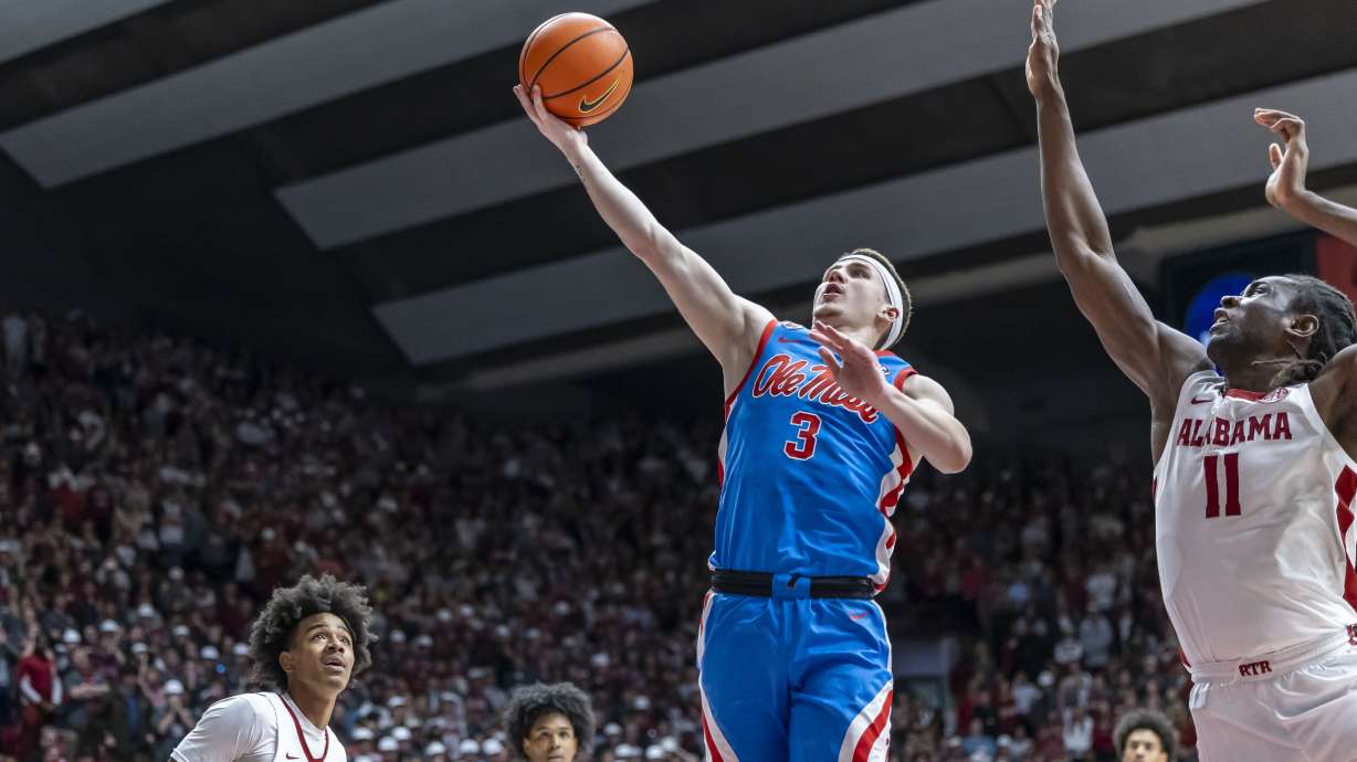Mississippi guard Sean Pedulla (3) gets past Alabama center Clifford Omoruyi (11) for a score during the first half of an NCAA college basketball game, Tuesday, Jan. 14, 2025, in Tuscaloosa, Ala.