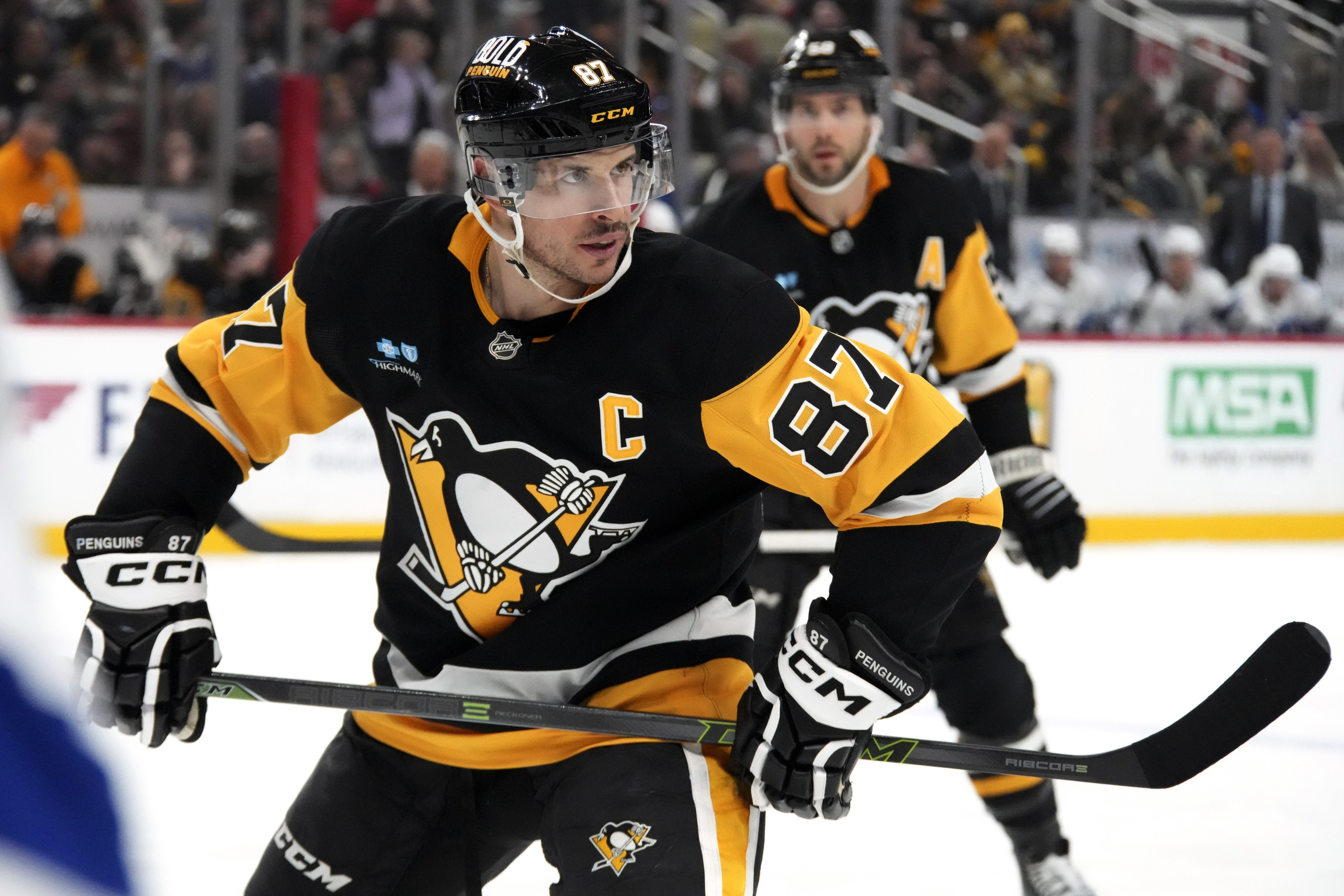 Pittsburgh Penguins' Sidney Crosby (87) prepares to take a face off during the second period of an NHL hockey game against the Tampa Bay Lightning in Pittsburgh, Sunday, Jan. 12, 2025.