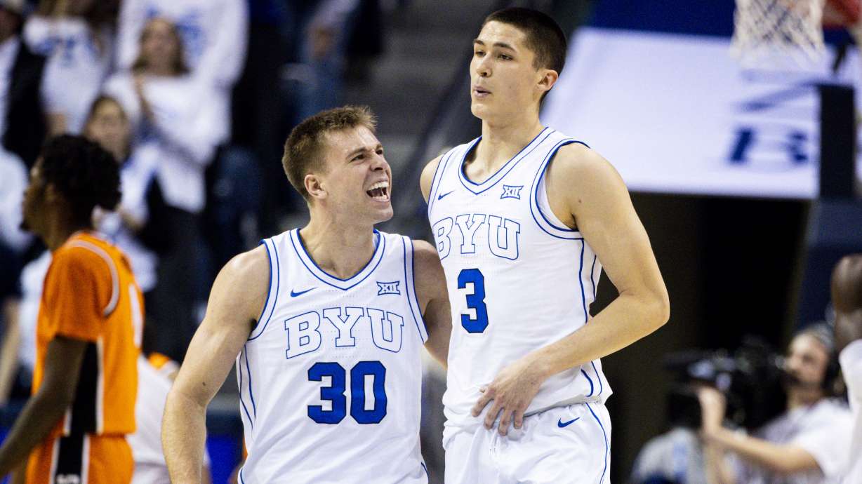BYU Cougars guard Dallin Hall (30) celebrates a play from guard Egor Demin (3) during an NCAA men’s basketball game held at the Marriott Center in Provo on Tuesday, Jan. 14, 2025.